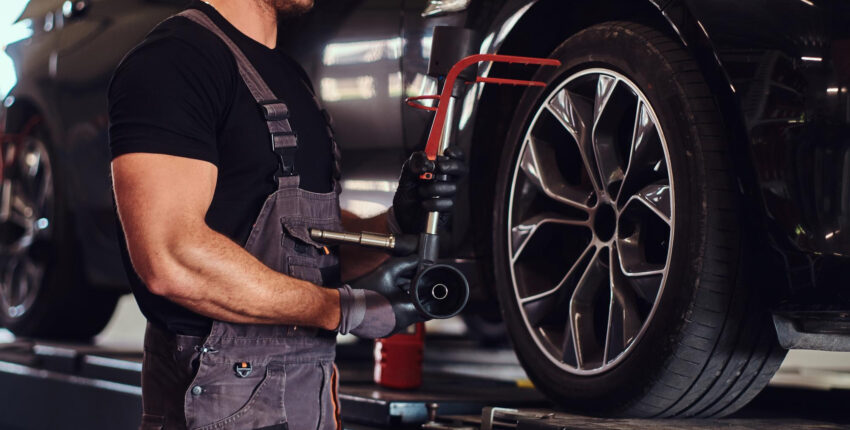Mechanic performing tire repairs