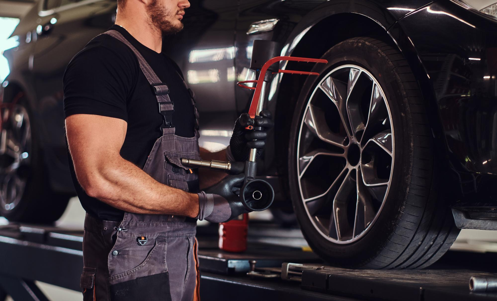 Mechanic performing tire repairs